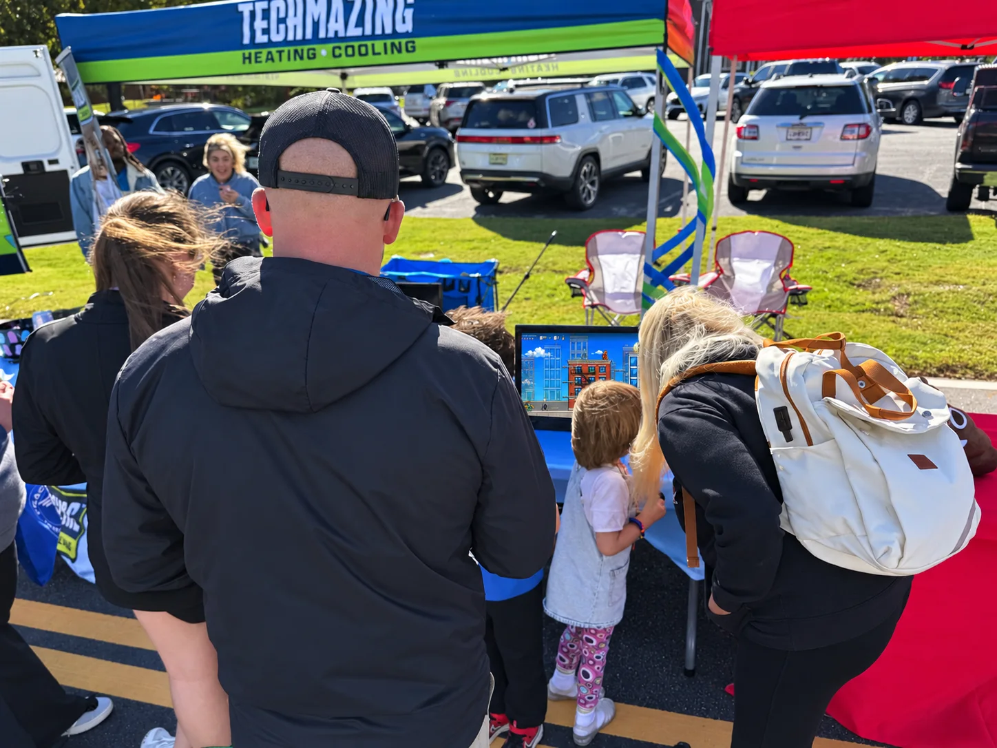 Visitors share a moment around the game.